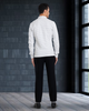 Back of model wearing custom wool Chino pants for men by Luxire in black next to window