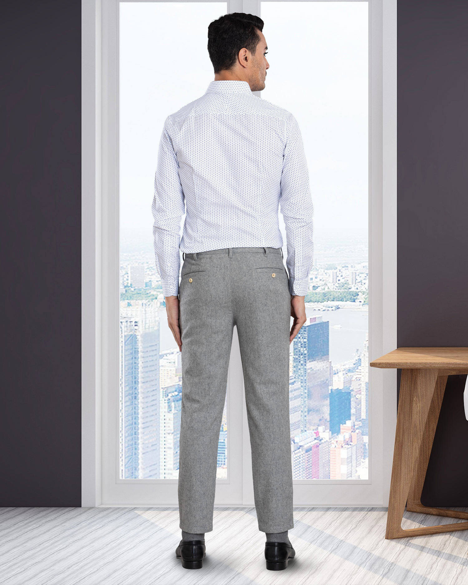 Back view of model wearing custom wool Chino pants for men by Luxire in grey