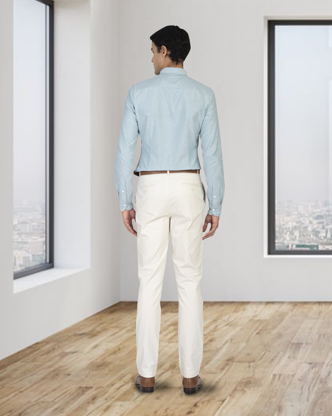 Back view of model wearing custom Genoa Chino pants for men by Luxire in ivory cream