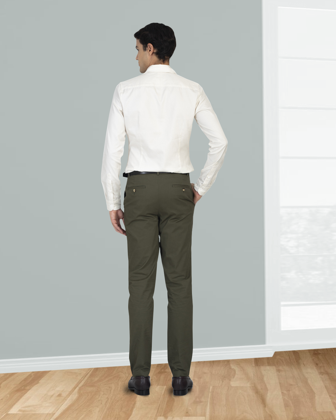 Back view of model wearing custom Genoa Chino pants for men by Luxire in olive green
