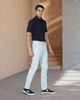 Model wearing custom Genoa Chino pants for men by Luxire in powder blue wearing black shoes