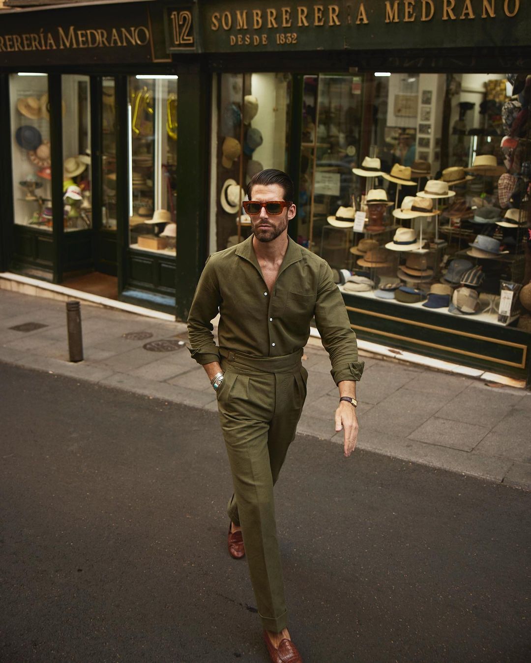 Male model outside wearing custom linen Gurkha pants for men by Luxire in olive