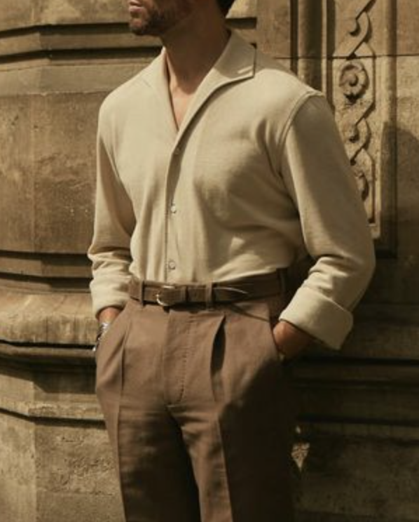 Front of model wearing custom linen canvas pleated pants for men by Luxire in brown
