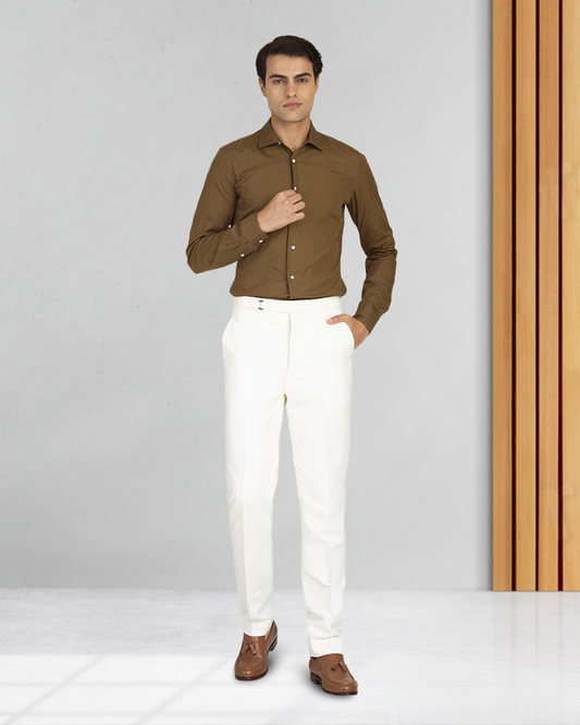 Male model wearing custom linen canvas pants for men by Luxire in white
