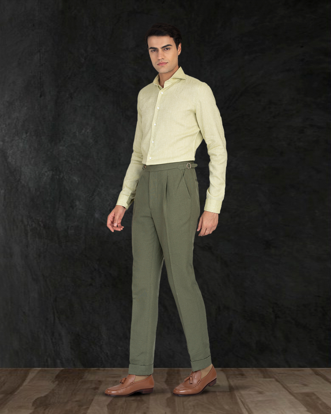 Model wearing custom linen canvas pants for men by Luxire in olive green