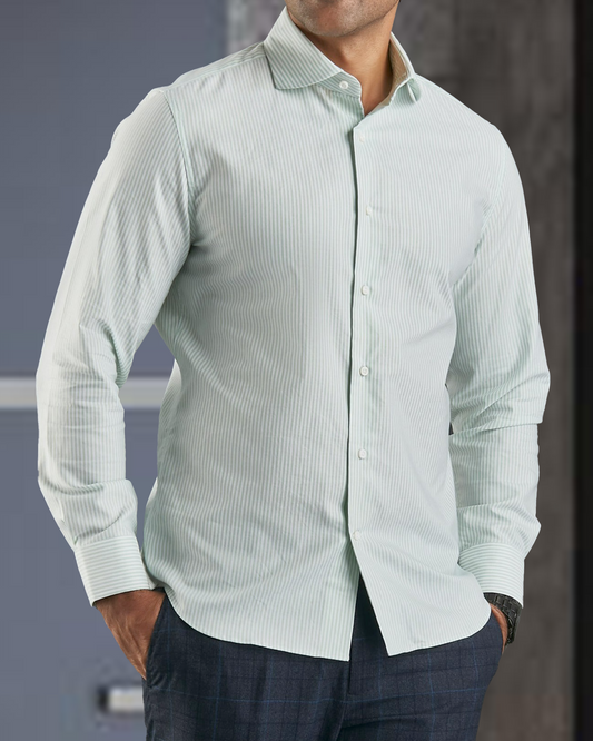 Front of model wearing the custom oxford shirt for men by Luxire in light green university stripes