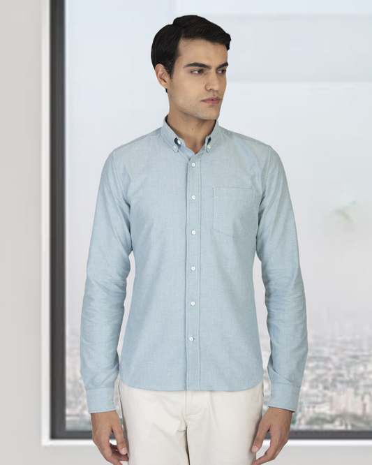 Model wearing the custom oxford shirt for men by Luxire in mint green