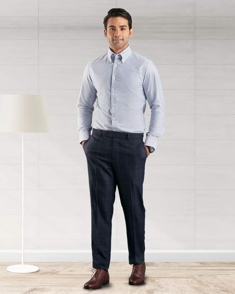 Front of model wearing the custom oxford shirt for men by Luxire with navy university stripes hands in pockets 2