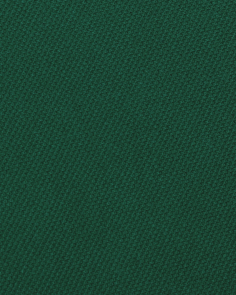 Close up of the custom oxford polo shirt for men by Luxire in racing green