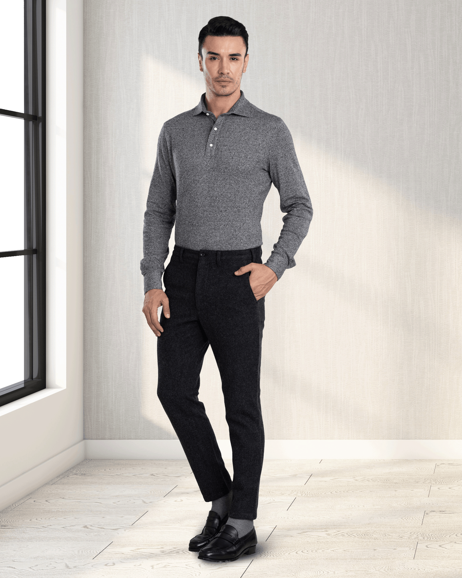 Model wearing the custom oxford polo shirt for men by Luxire in dark light grey hand in pocket