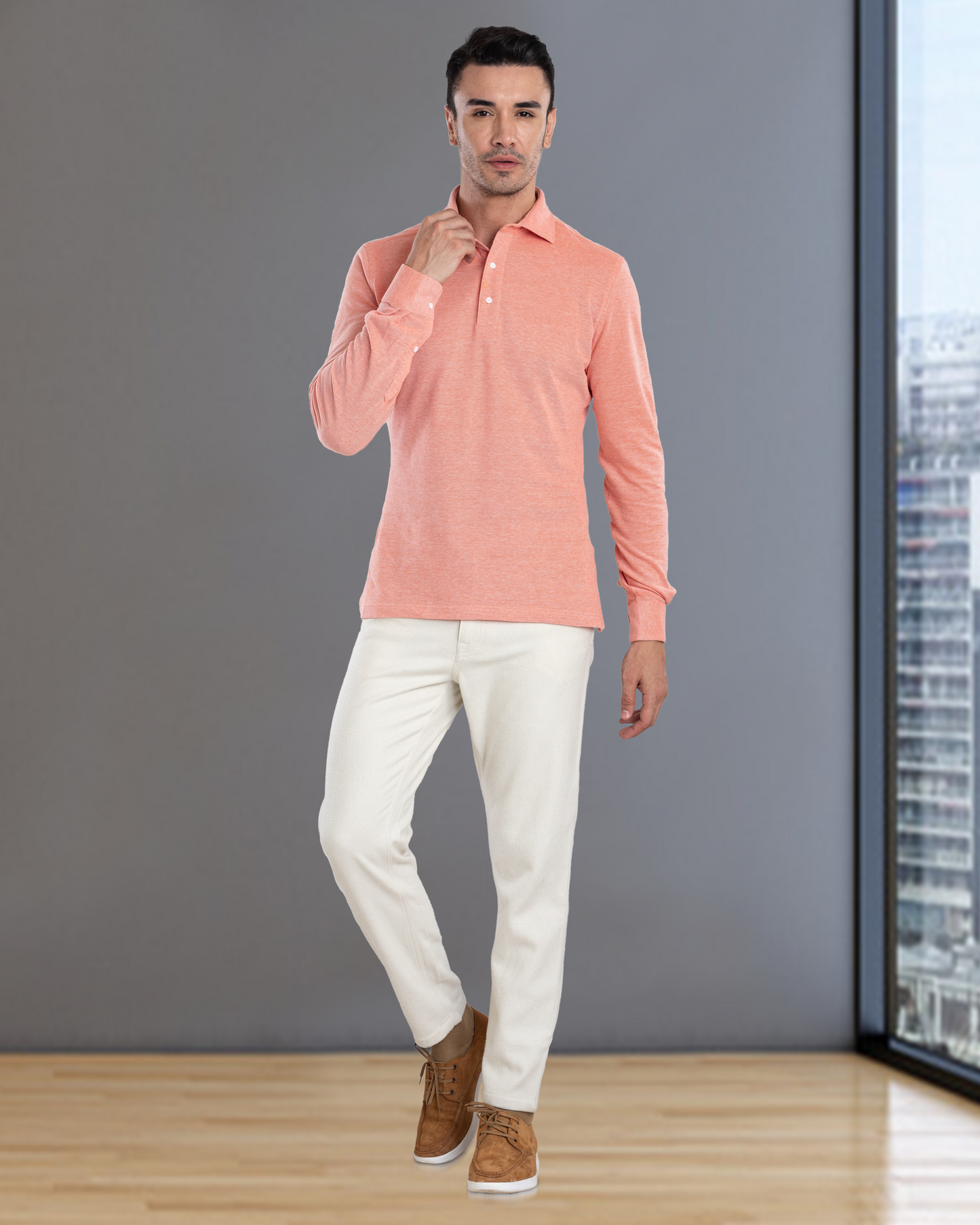 Front of model wearing the custom oxford polo shirt for men by Luxire in orange white