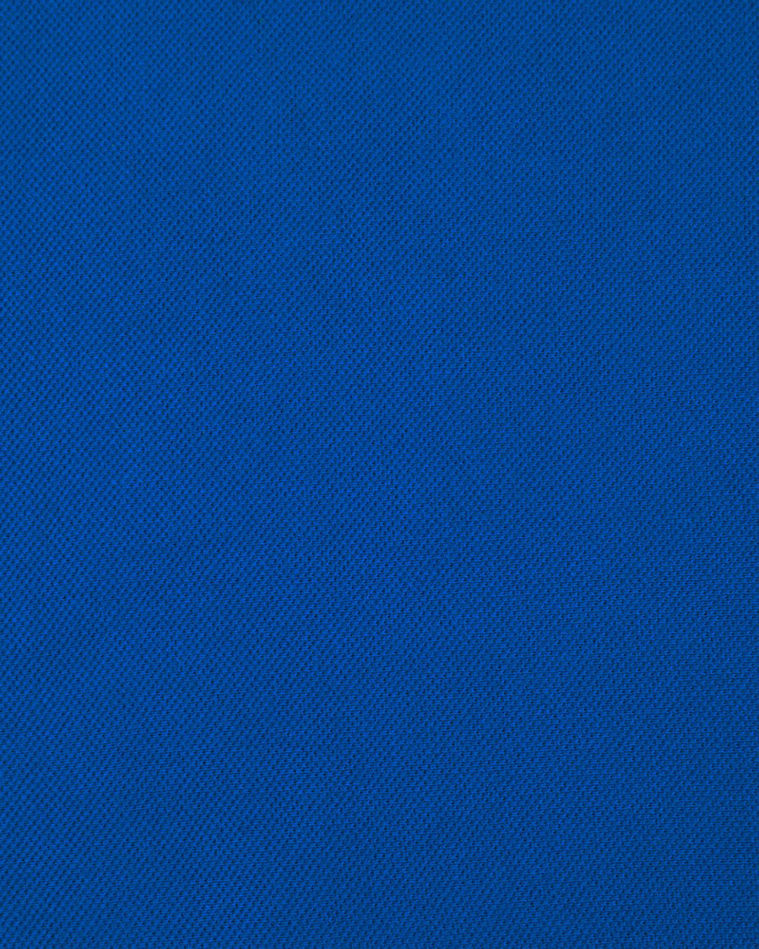 Close up fabric of the custom oxford polo shirt for men by Luxire in royal blue