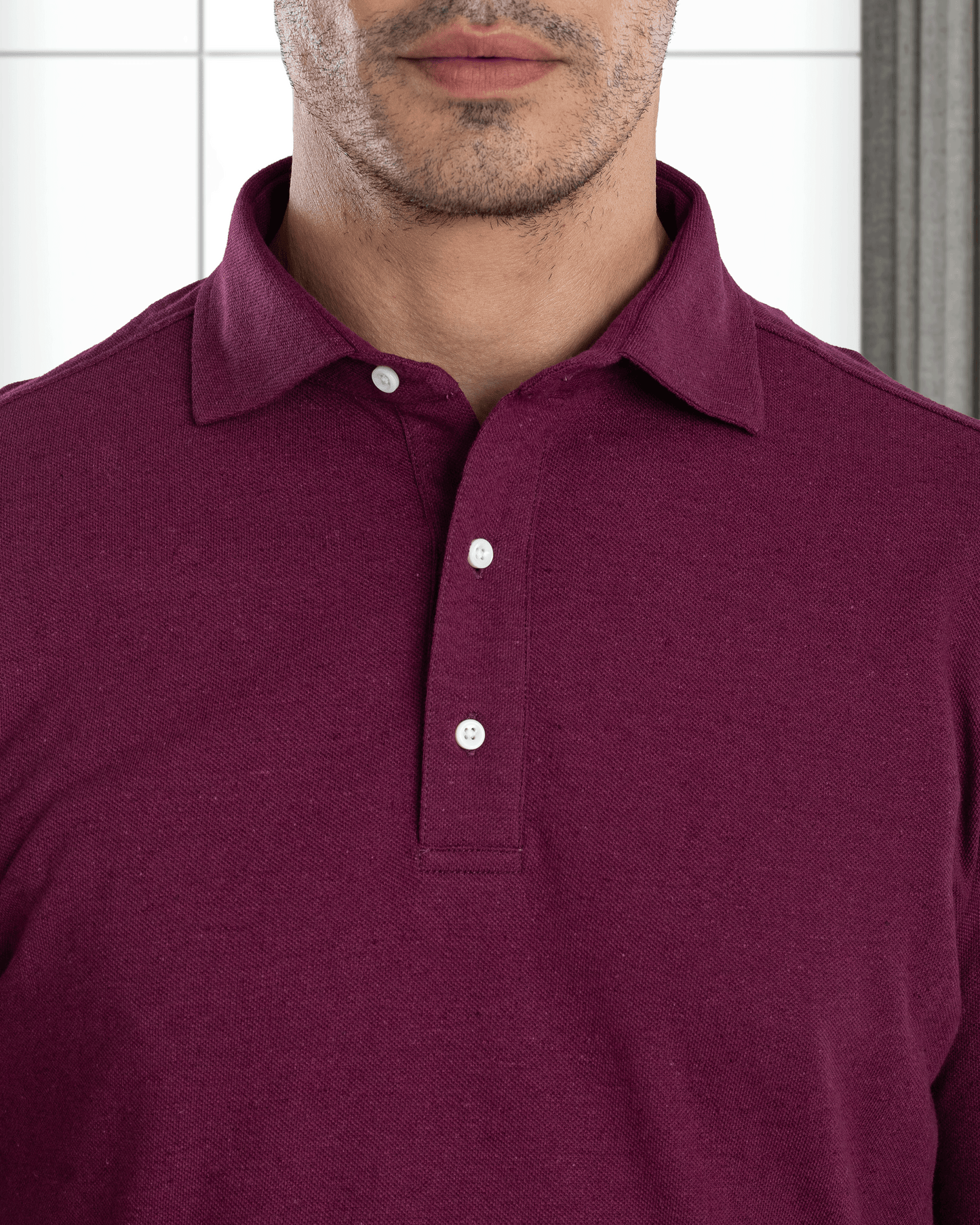 Model wearing mens wool jeans by Luxire in black wearing purple shirt 2