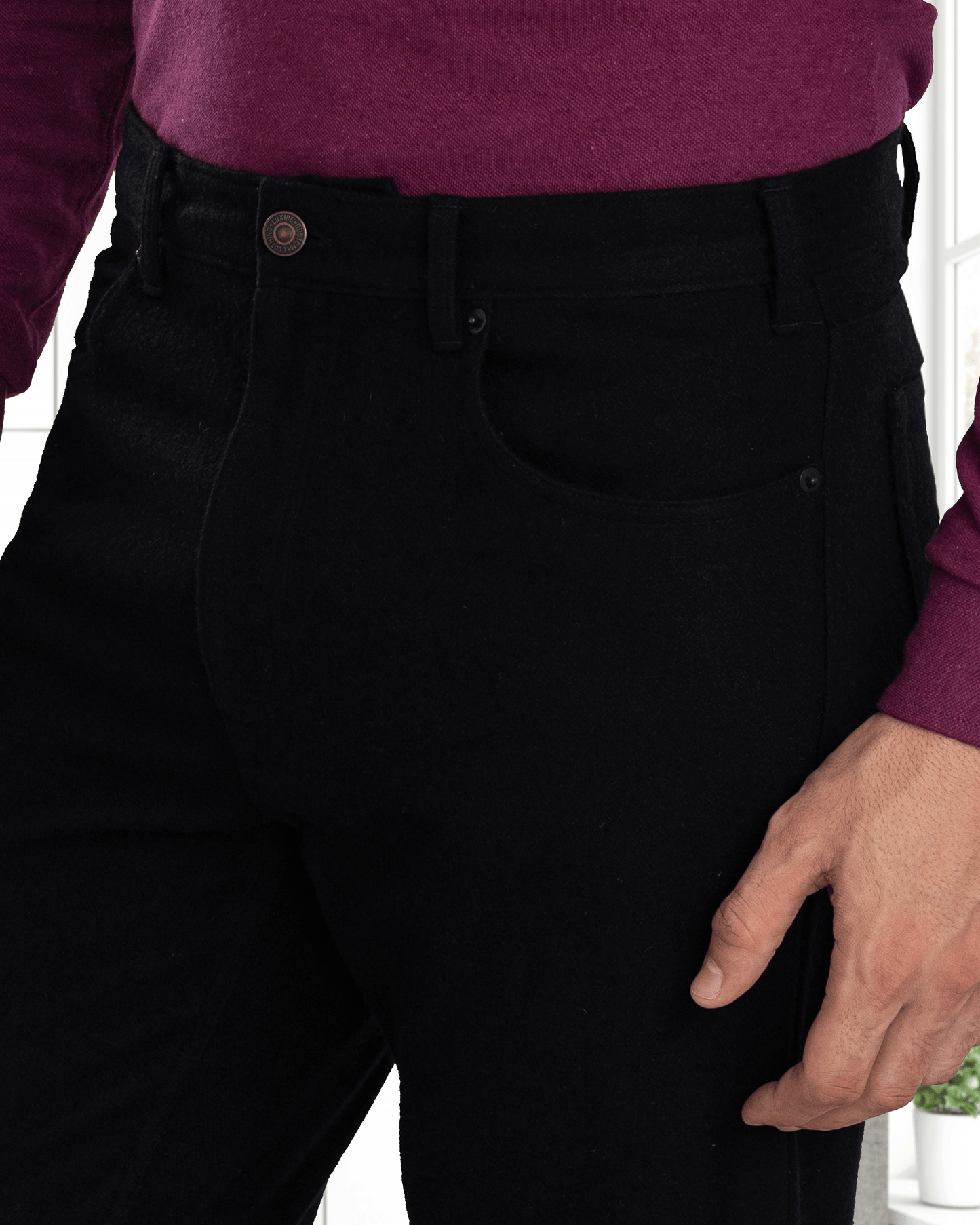 Model close up wearing mens wool jeans by Luxire in black