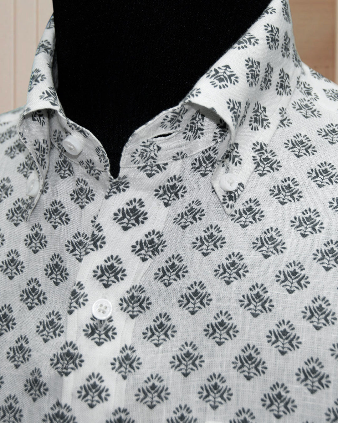 Front close up view of custom linen shirt for men by Luxire in black flower print