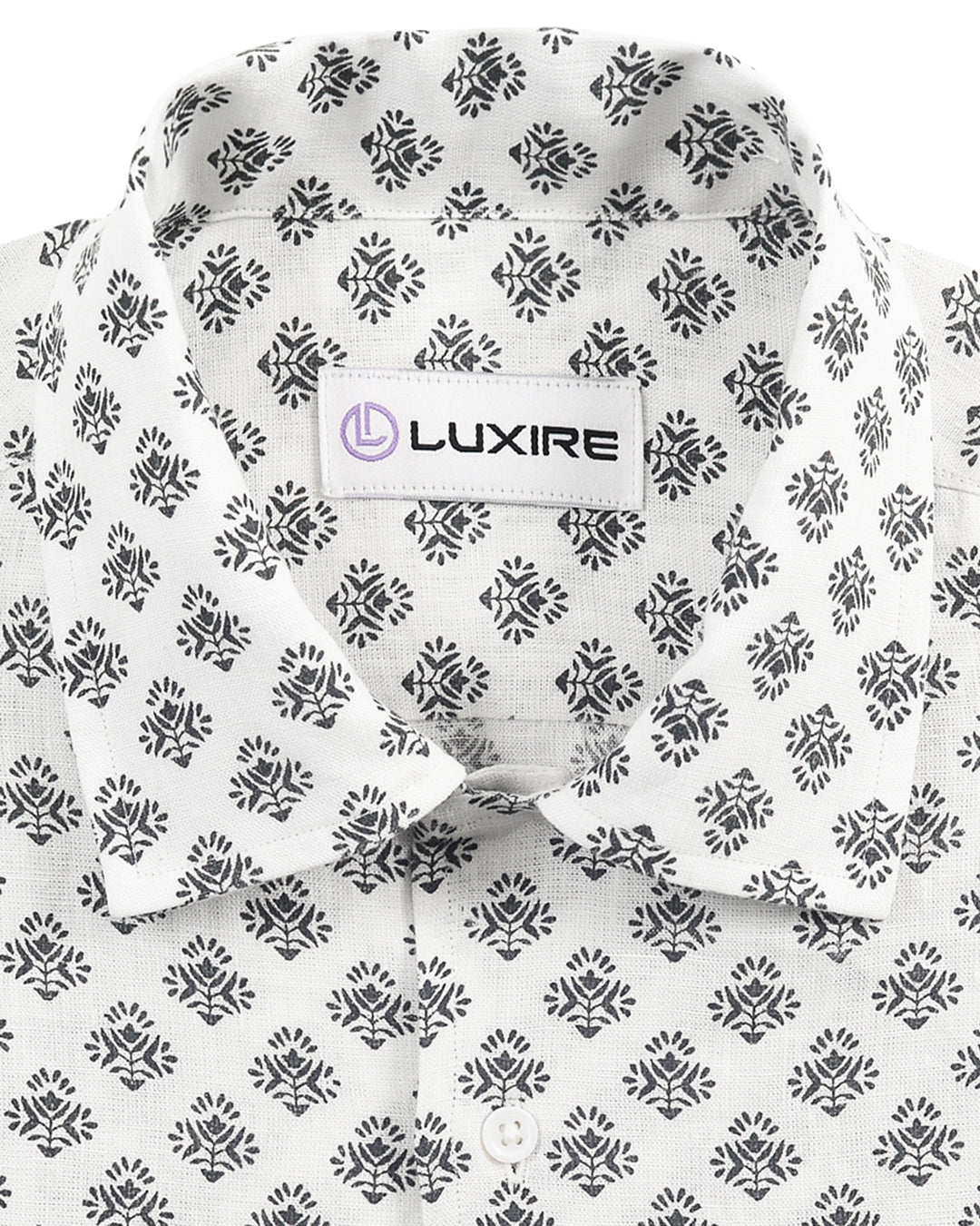 Front close up view of custom linen shirt for men by Luxire in black flower print 2
