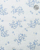 Close up view of custom linen shirt for men in pale blue printed shrubs