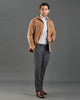 Side of model wearing the woolen flannel shirt jacket for men by Luxire in tan hands in pockets