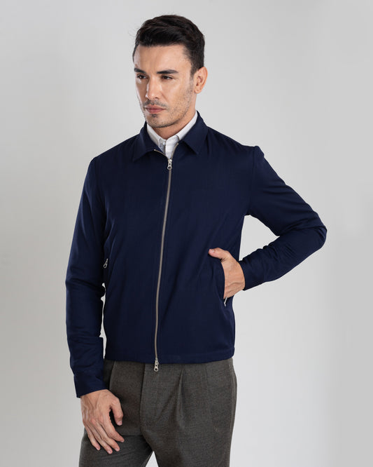 Model wearing the covert twill shirt jacket for men by Luxire in navy