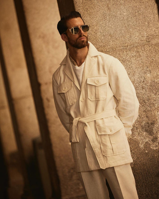 Front of model wearing the safari jacket in linen cotton for men by Luxire in off white